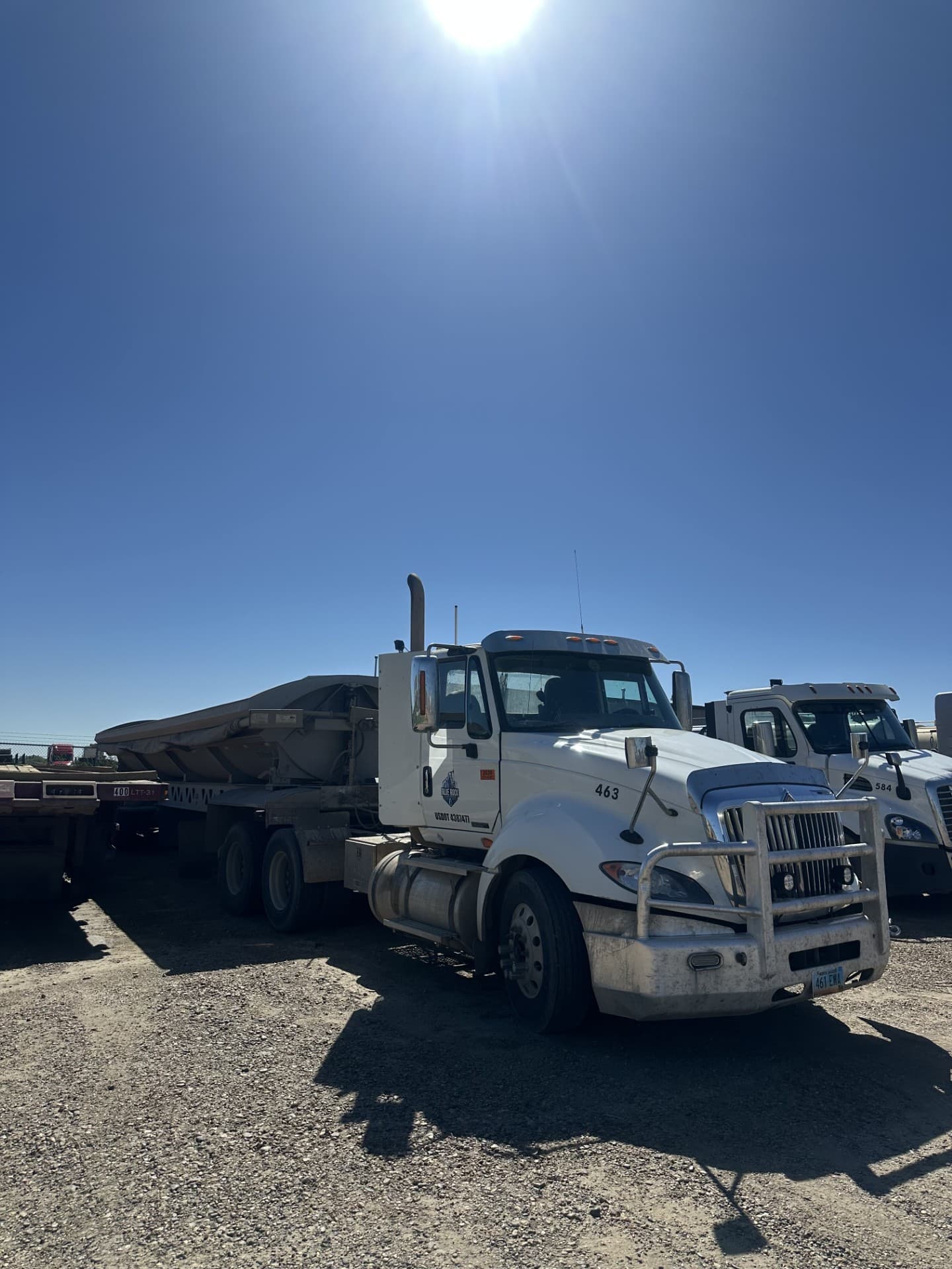 Blue Rock International with a side-dump trailer, unit 463